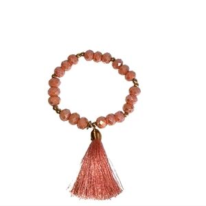 Pink tassled  beaded bracelet. Elastic